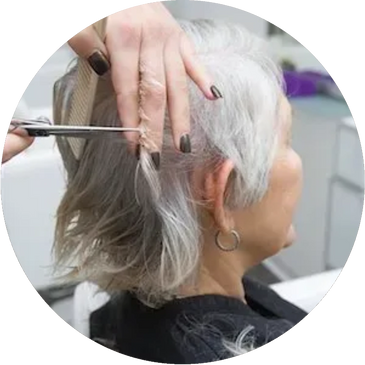 A senior getting her hair cut at the beauty salon