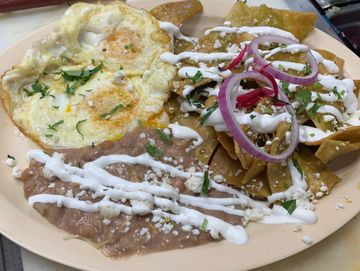 Chilaquiles: Mexican style breakfast nachos with Green Chili or Salsa Ranchera 