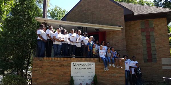 Group posing outside Metropolitan A.M.E. Zion Church.