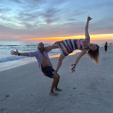 Acroyoga at sunset on a beach in St Petersburg, FL