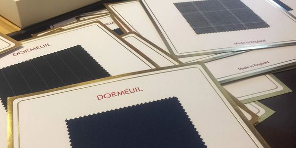 swatches of fabrics we use to make a custom suit