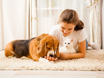 Woman with dog and cat