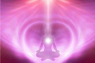 Person sitting in meditative pose purple magenta energy