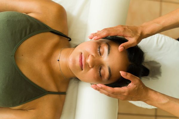 Close-up of a woman receiving a relaxing facial massage