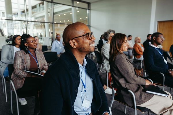 Business professionals attending a formal seminar or conference