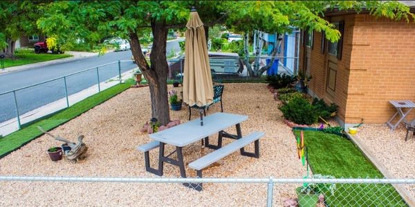 Family Man Handyman business doing skilled laborer work on the outside patio of a home.