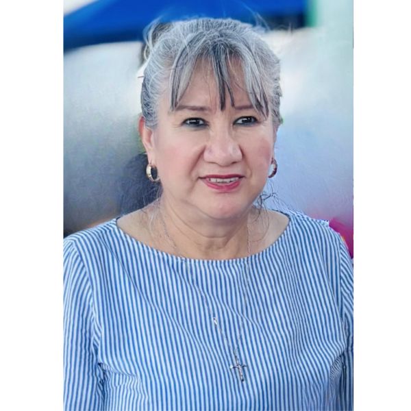 Smiling woman wearing a blue and white striped top.
