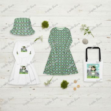 Matching kids' outfits and accessories with character prints laid out on a wooden floor.