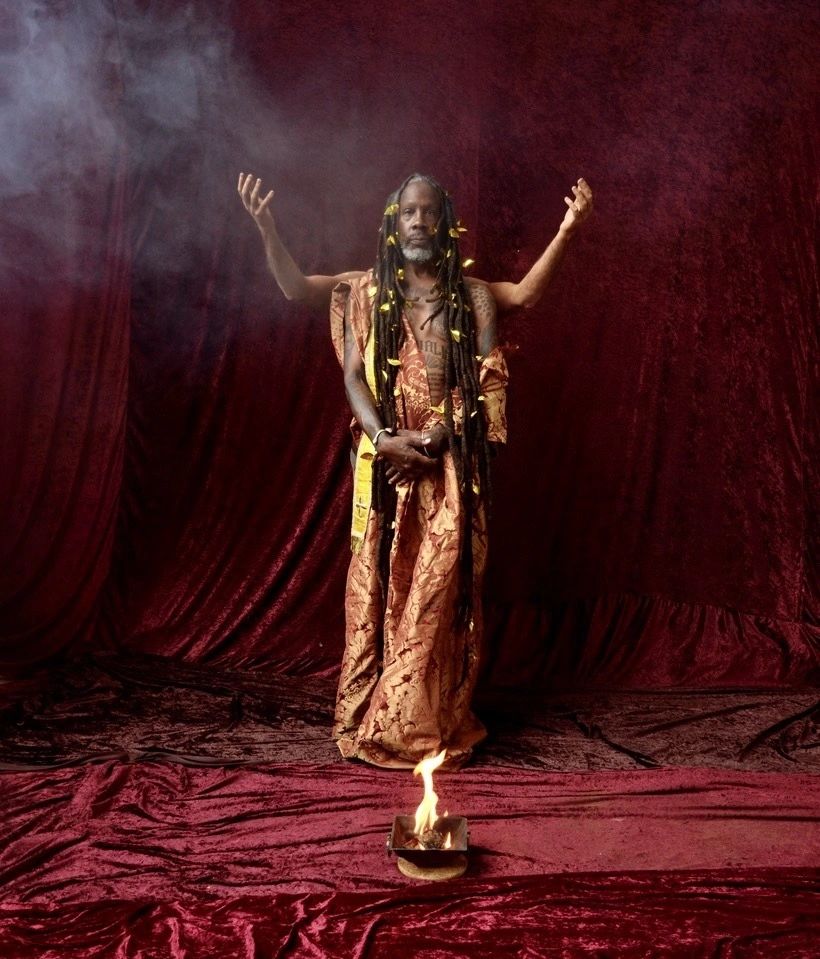 A Black artist dressed in Gold