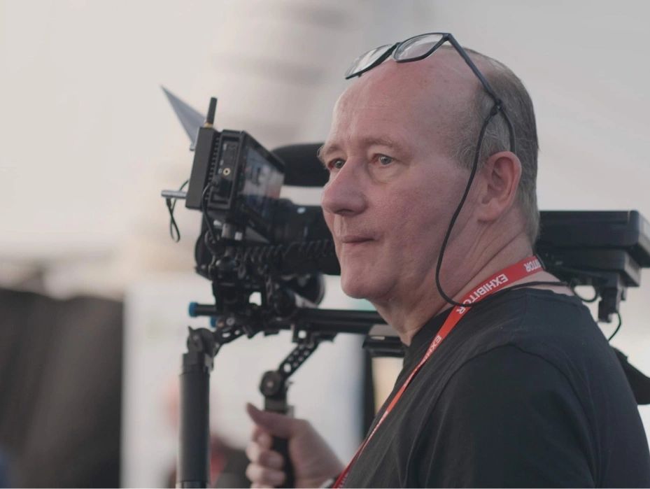 Man operating a professional camera rig.