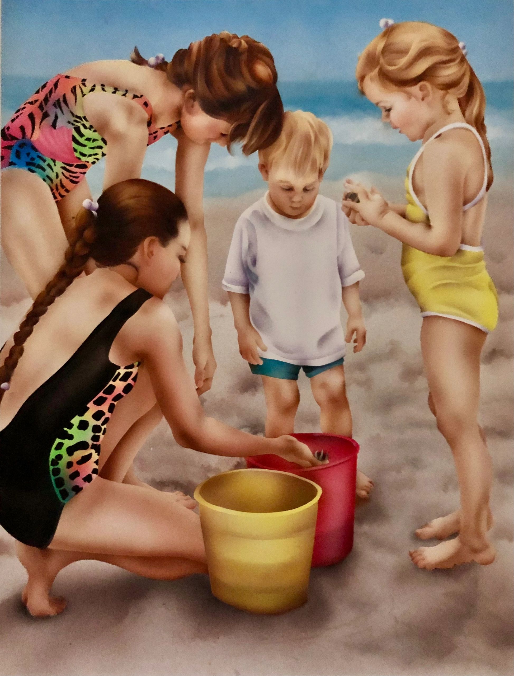 Four children playing with buckets on the beach under a blue sky.