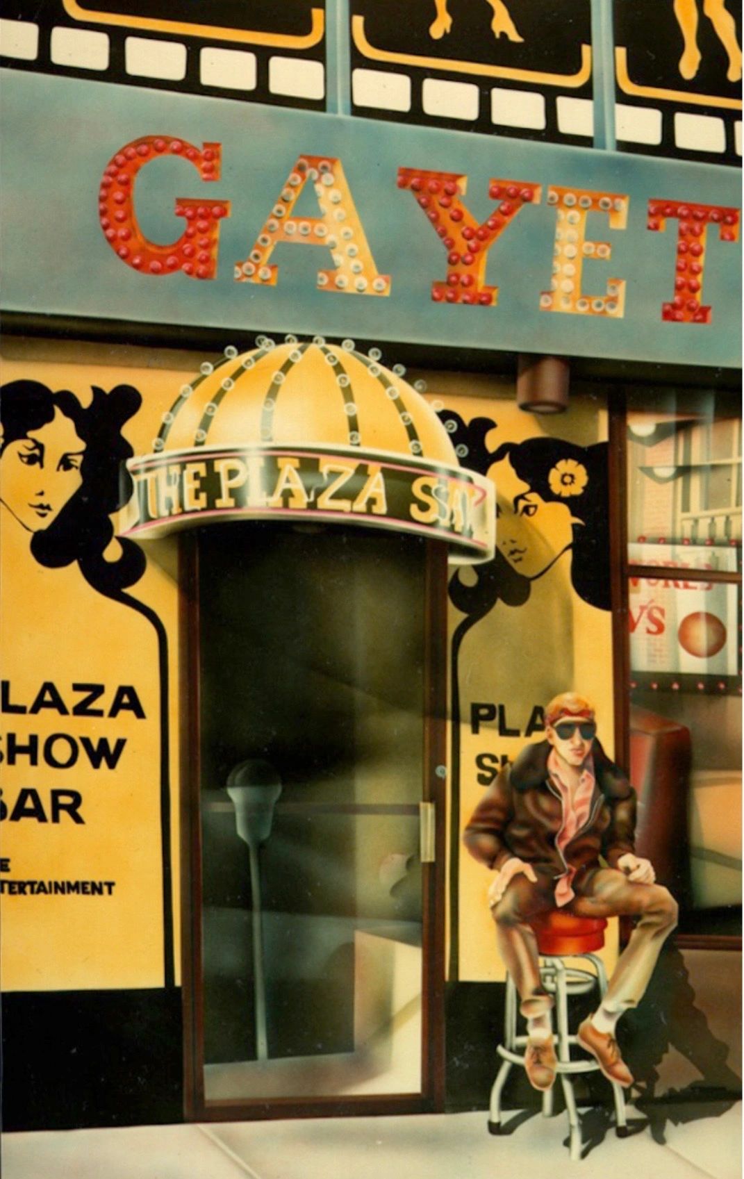 Man sitting outside a colorful show bar entrance with vintage signage.