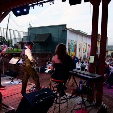Band playing music on the outdoor stage
