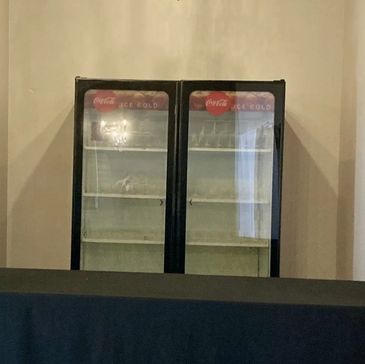 Drinks area with a glass front beverage refrigerator 