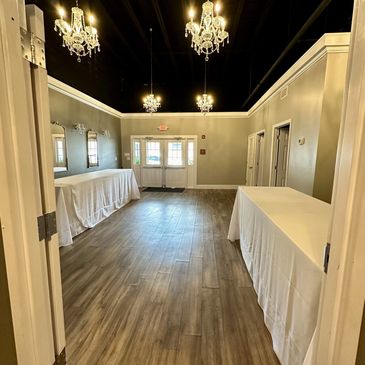 Entryway with tables and chandeliers 