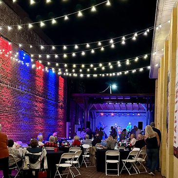 Outdoor concert with string lighting