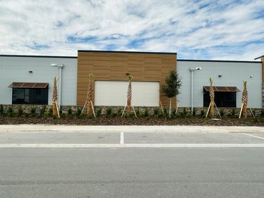 two bahama style metal awnings mounted above a window