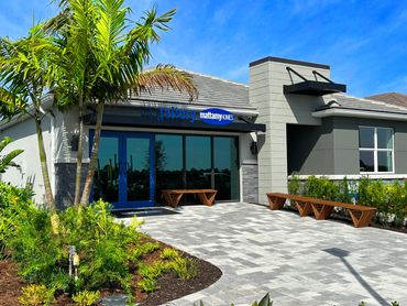 a black metal awning with a blue sign in front that states the gallery mattamy homes