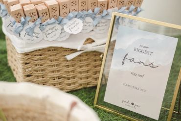Basket with thank-you notes and a framed sign for guests.