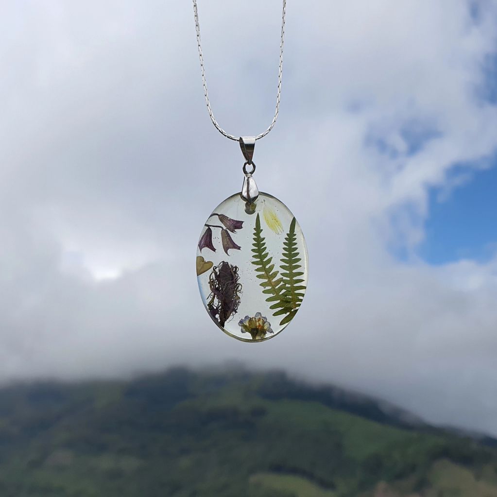 handmade pendant with real ferns and a feather