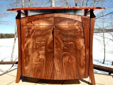 handcrafted wood cabinet with drawers and doors