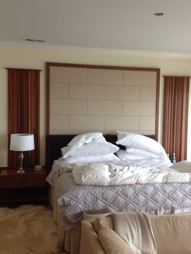 handcrafted wood and suede bed, nightstands, and wall sconces
