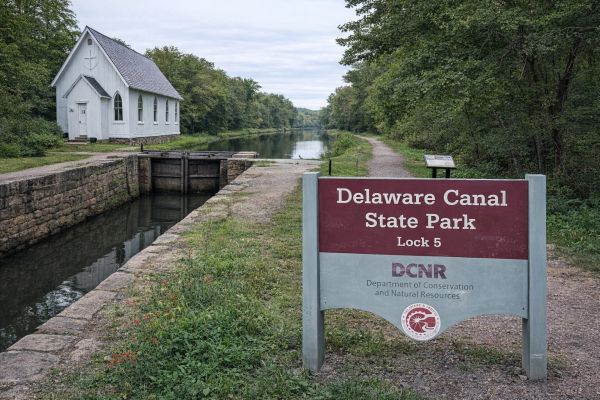Delaware Canal State Park Lock 5 with a white chapel and canal.