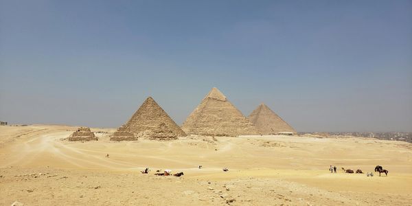 Pyramids surrounded by miles of sand.