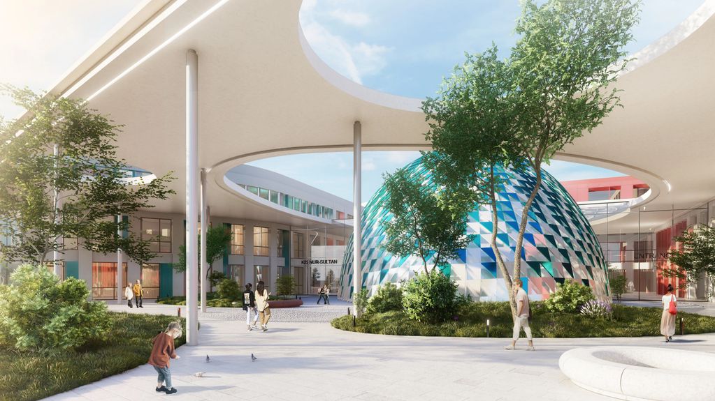 Modern courtyard with circular openings and a colorful dome structure.