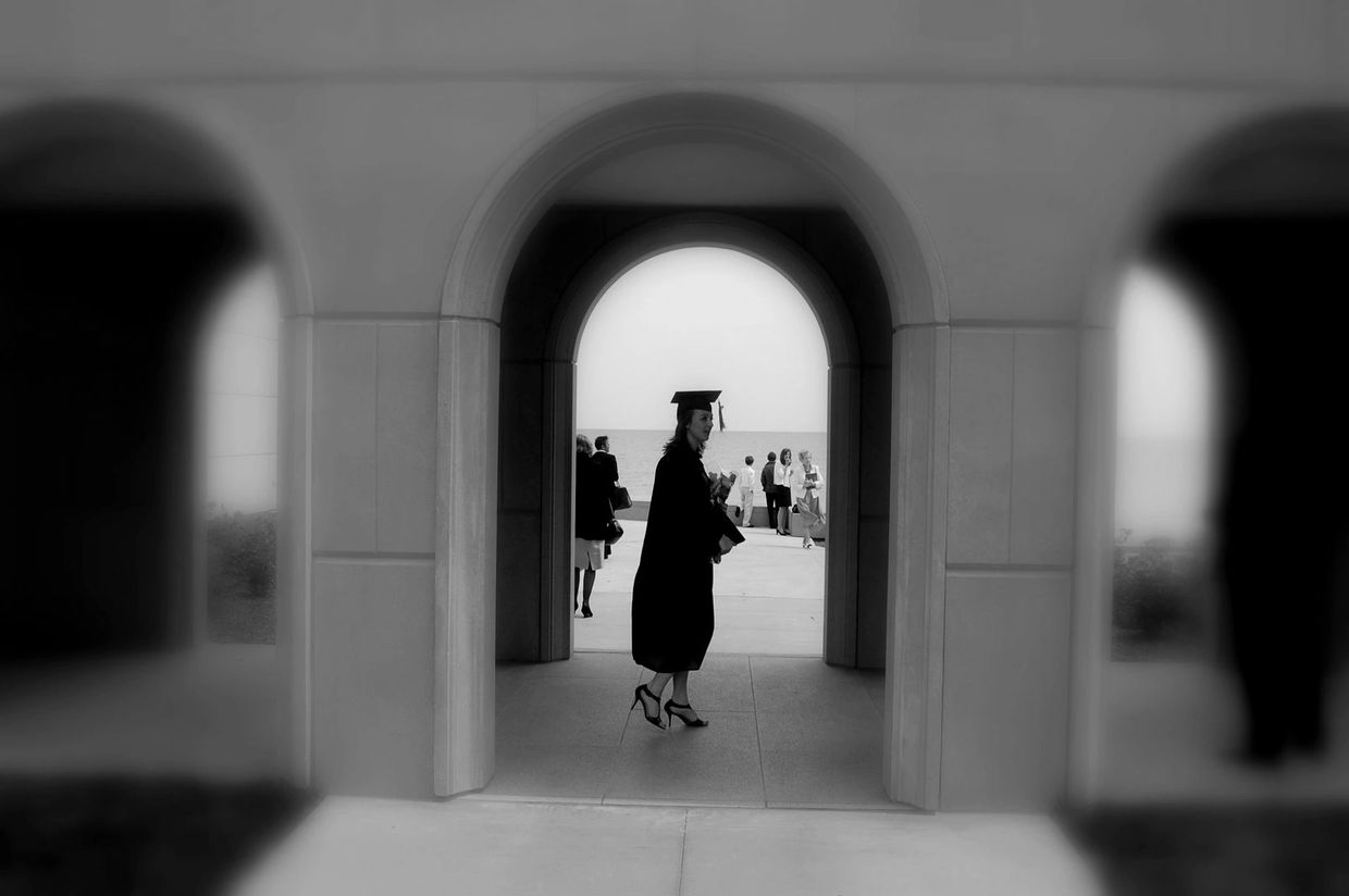 Image of me at my undergraduate graduation at Loyola University Chicago. The first step in completin