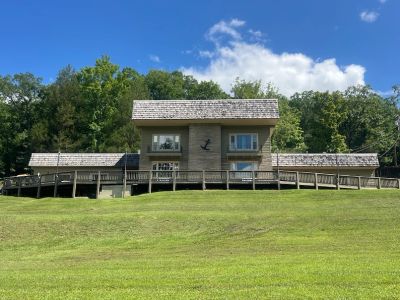 Exterior of the Pine Lodge building with anchor emblem at Star Point Resort on Dale Hollow Lake