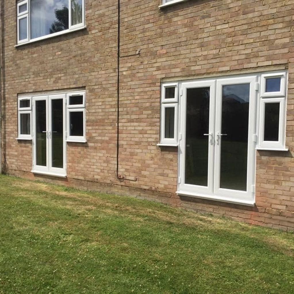 White upvc windows and doors on a brick building