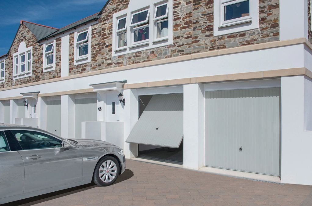 white upvc windows and white up & over garage doors