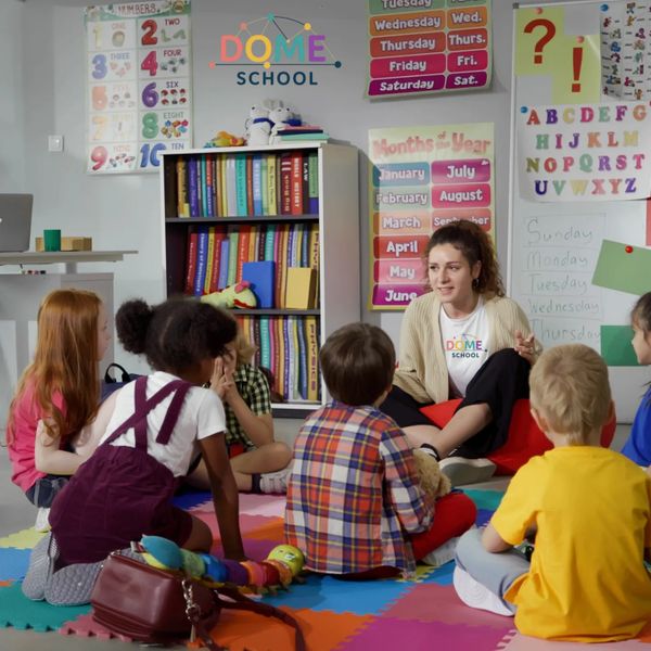 Teacher engaging young children in a colorful classroom circle time.