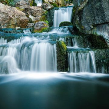 A cascading waterfall. photo credit: Mike Lewis HeadSmart Media on Unsplash