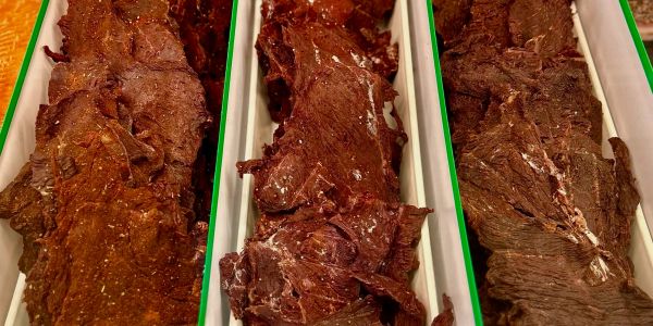 Close-up of dried beef jerky pieces arranged in trays.