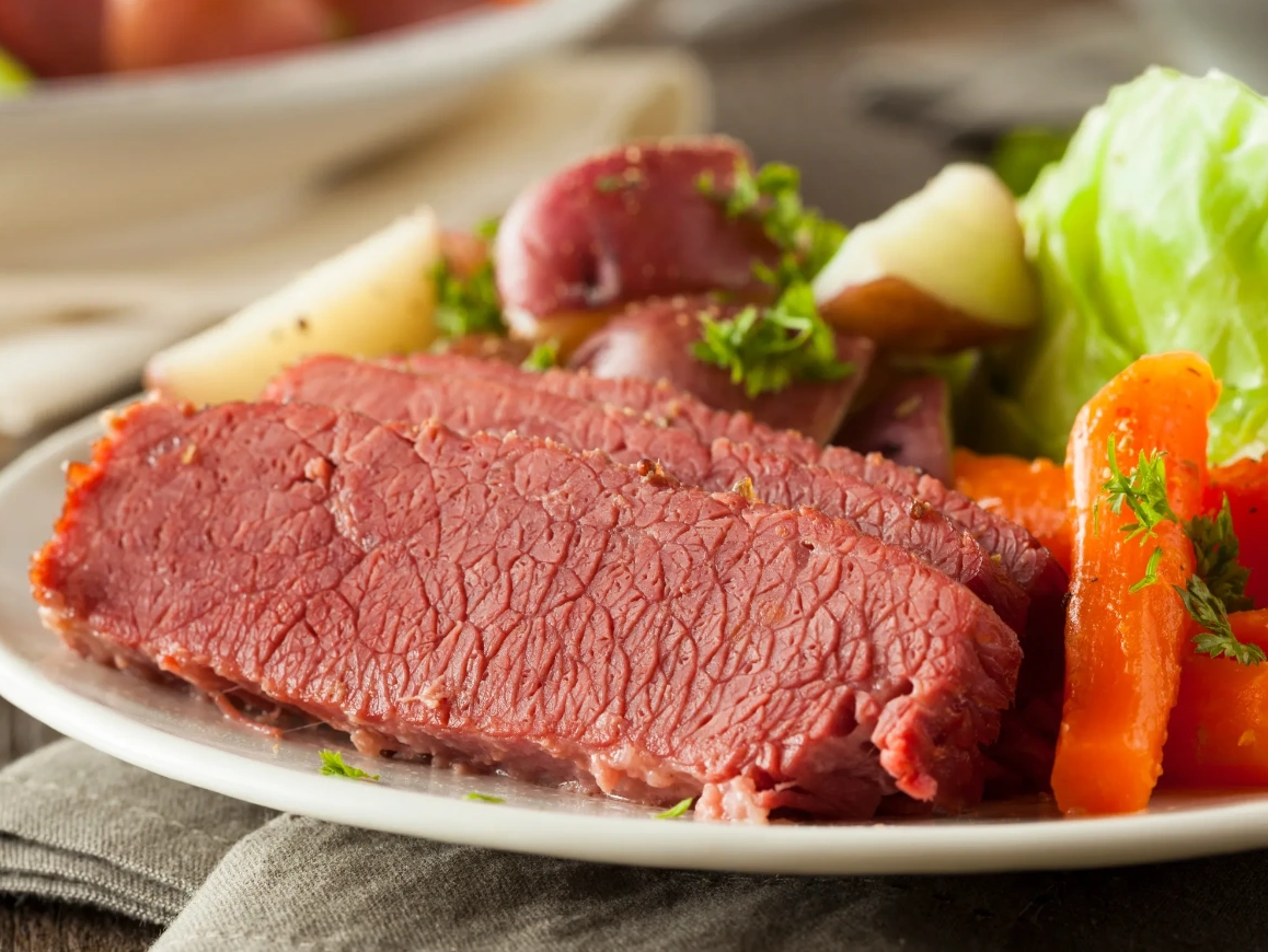 Photo of Corned Beef Brisket dinner with carrots, potatoes and cabbage from F & D Meats. 