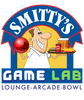 Logo of Smitty's Game Lab featuring a cartoon character with a game controller.