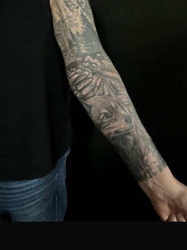 black and grey realism wolf tattoo sleeve 