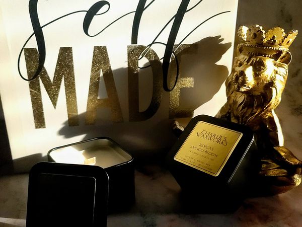 Mango scented candle; golden lion with crown and self empowerment elements on a marble background