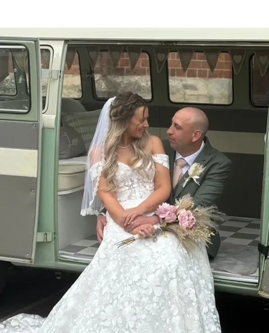 Bride and groom sitting in a vintage van on their wedding day.