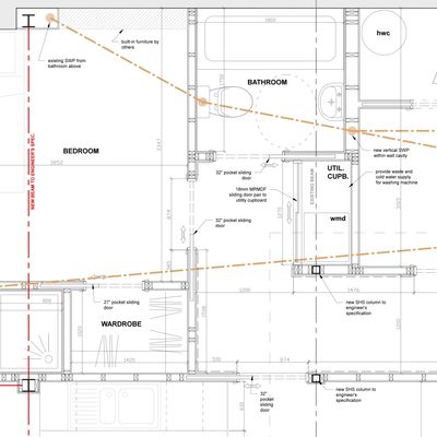 Architectural floor plan showing bedroom, bathroom, wardrobe, and utility areas.