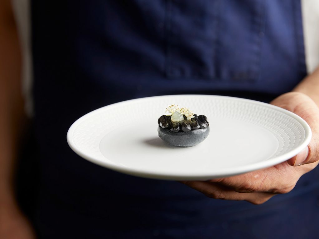 Chef Min Kim preparing gourmet Asian-fusion course for private dinner