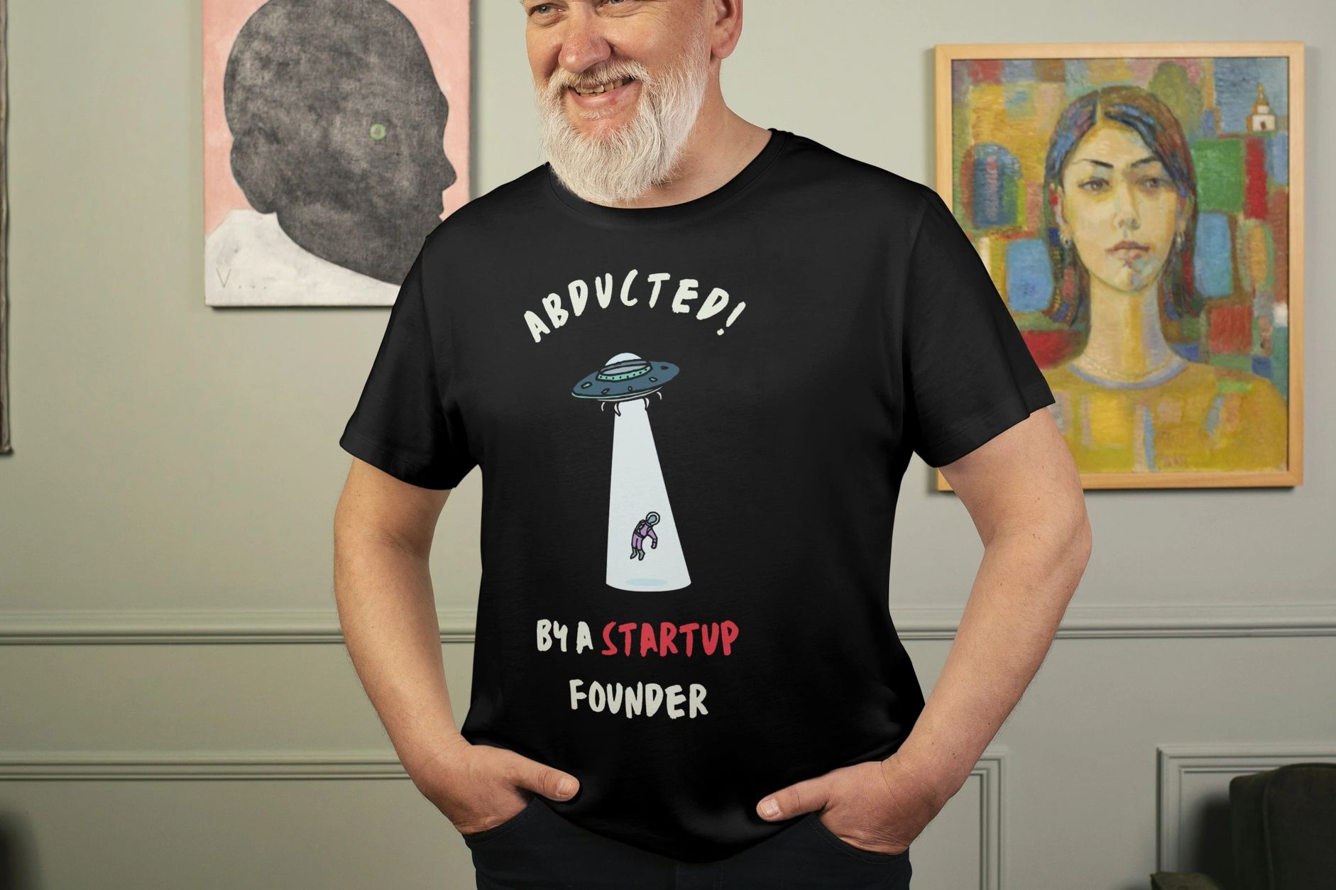 Black T-shirt, paired with the humorous phrase "Abducted by a Startup Founder"