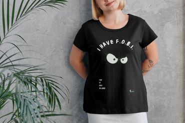 Black T-shirt featuring text 'I Have F.O.B.I.  Fear of Being Included' in playful fonts