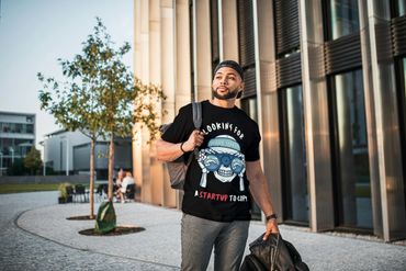 Black T-shirt  'Looking for a Startup to Copy – Wave Seeker' in playful fonts.