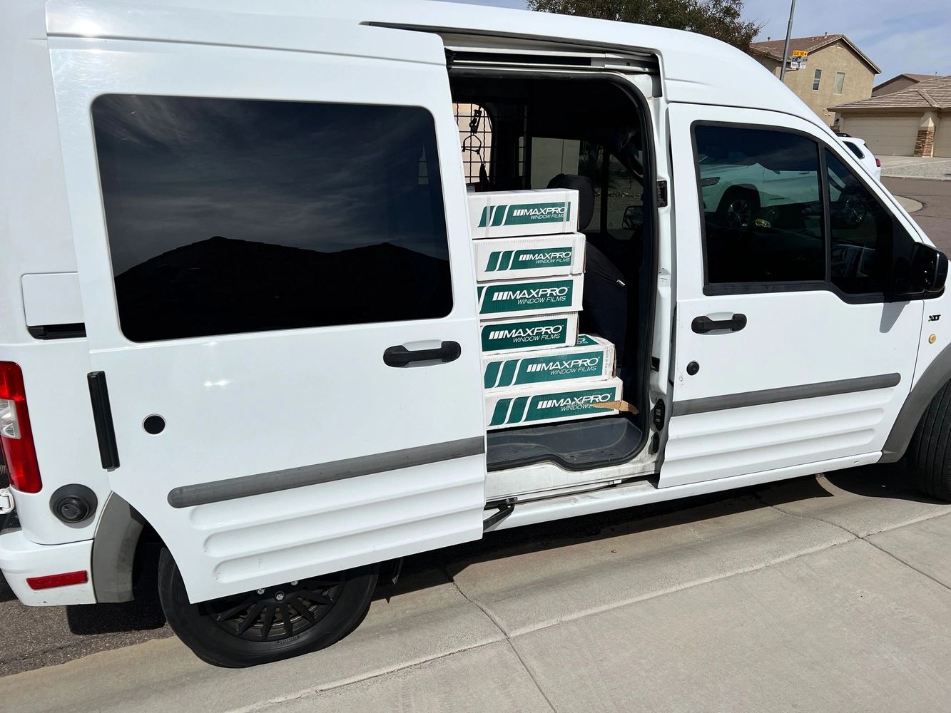 SunTrust installation Van with door open showing partial film stock.