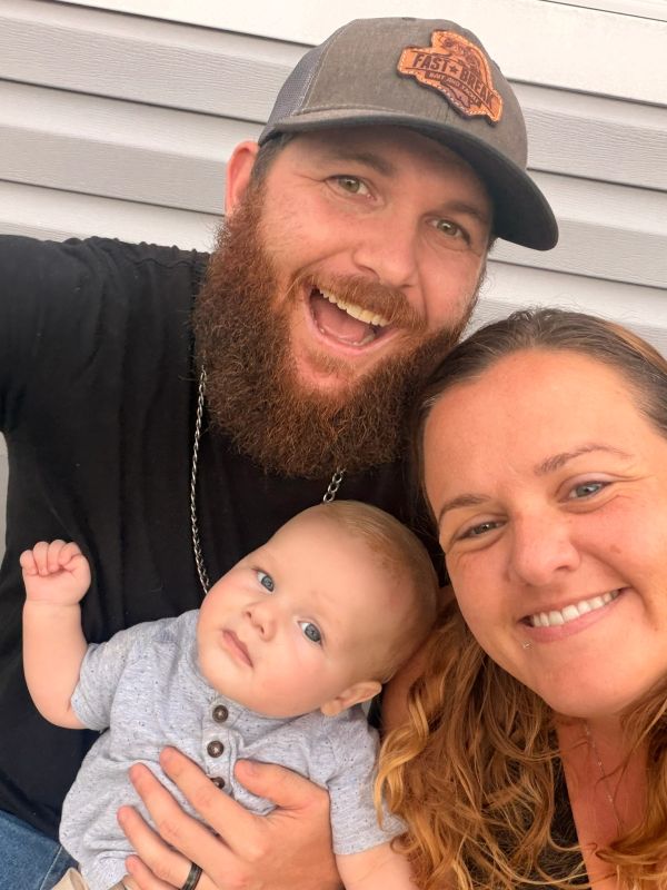 Happy family selfie with baby.