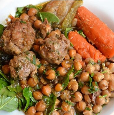 A picture of a Sephardic dish called Adafina showing carrots, chick peas, and meat.