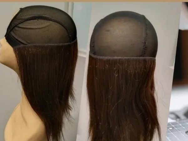A wig cap with attached brown hair shown from side and back views.